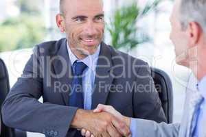 Businessman handshaking colleague