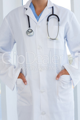 Female doctor standing with hands in pocket Female doctor standing with hands in pocket