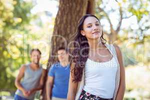 Pretty hipster smiling in the park