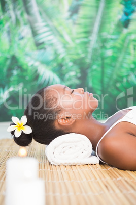 Side view of a beautiful woman on massage table