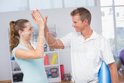 Woman celebrating with her trainer