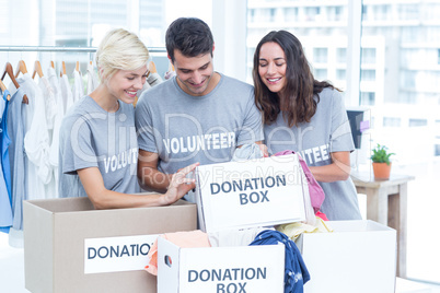 Volunteers friends checking a donation list