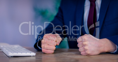 Angry businessman with closed fists