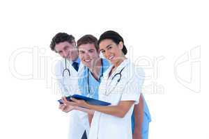 Doctors and nurses discussing over notes