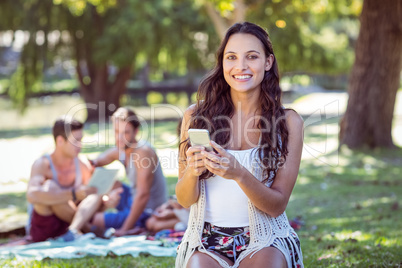 Pretty hipster using her smartphone