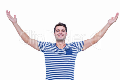 Handsome hipster smiling at camera with arms outstretched