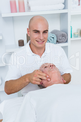 Man receiving head massage