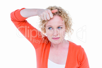 Pretty blonde woman with hand in hair