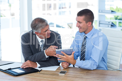 Businessmen working together with tablet