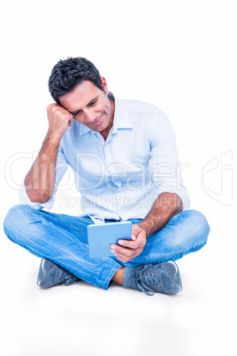 Handsome man using tablet computer