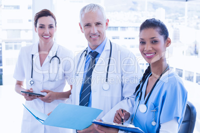 Doctors working together on patients file