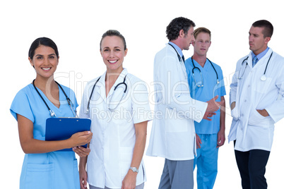 Doctors and nurses discussing over notes