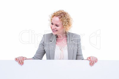 Happy woman holding blank sign