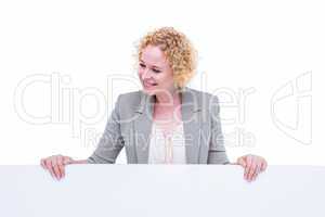 Happy woman holding blank sign