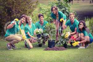 Happy friends gardening for the community