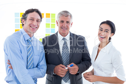 Smiling business people brainstorming together