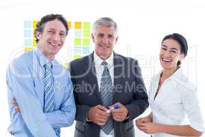 Smiling business people brainstorming together