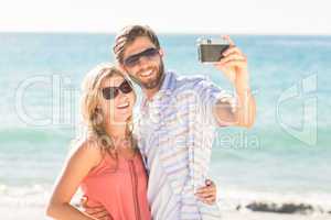 Happy couple taking selfie