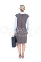 Back turned businesswoman holding a briefcase