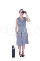 A businesswoman looking through binoculars