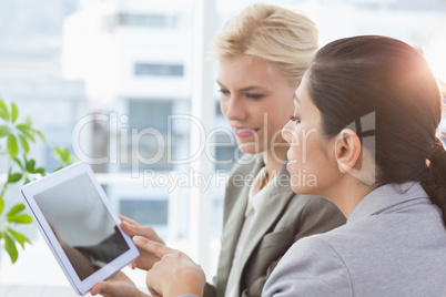 Businesswomen using tablet