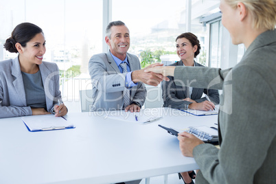 Interview panel listening to applicant