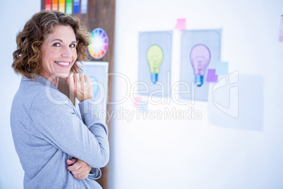 Creative businesswoman looking at camera