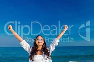 Happy woman smiling at the beach