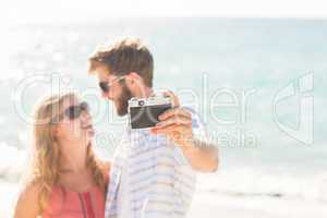 Happy couple taking selfie