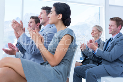 Business people applauding during meeting