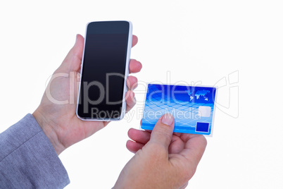 Hands of woman holding smartphone and credit card