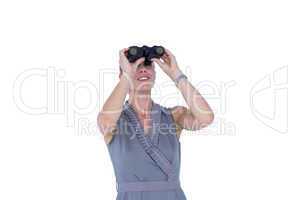 A businesswoman looking through binoculars