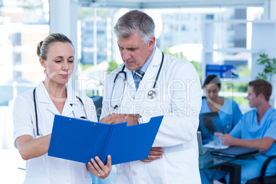 Team of doctors working on their files