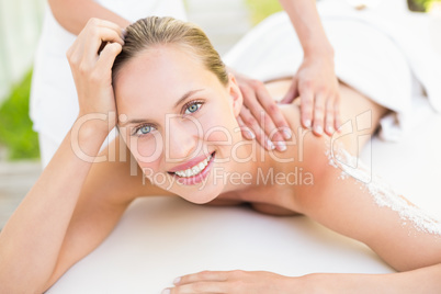 Beautiful woman lying on massage table