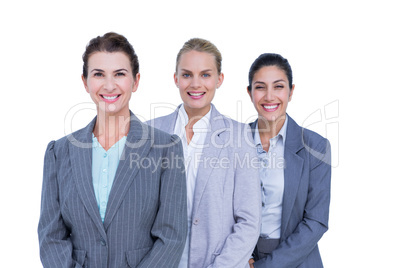 Smiling young businesswomen in a line