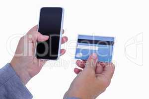 Woman holding credit card and smartphone