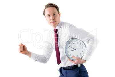 A businessman running with clock