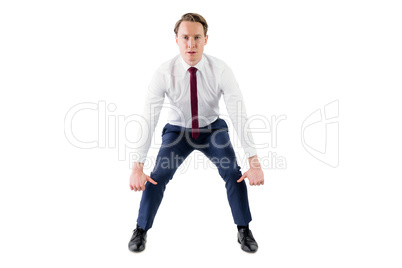 A serious businessman lifting something