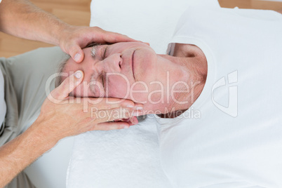 Man receiving head massage