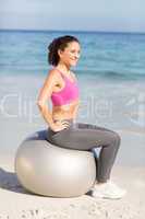 Fit woman doing fitness on exercise ball