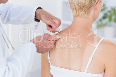 Doctor examining his patient back