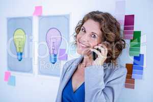 Creative businesswoman having phone call