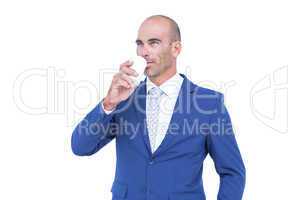 Happy businessman drinking cup of coffee
