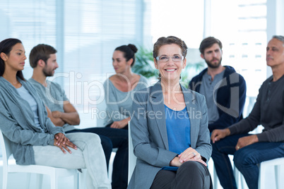 Therapist with group therapy in session