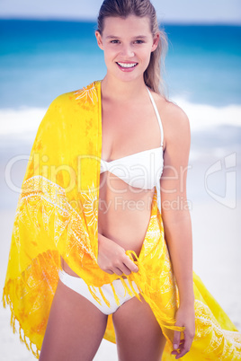 Pretty girl wearing a sarong on the beach