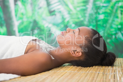 Pretty woman lying on massage table