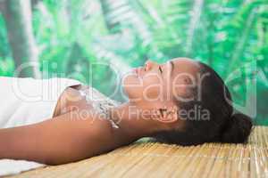 Pretty woman lying on massage table