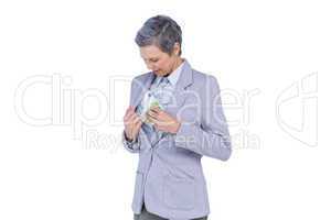 Businesswoman hiding money in her suit