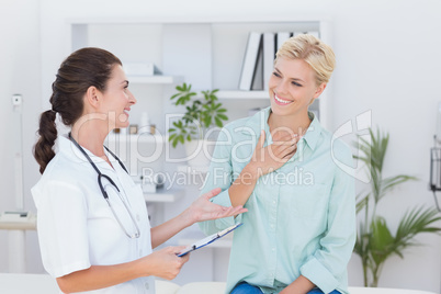 patient smiling to her doctor