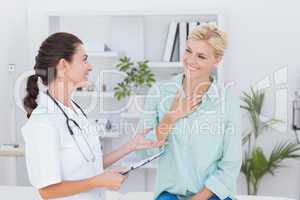 patient smiling to her doctor